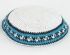 White knitted kippah with light blue and black border